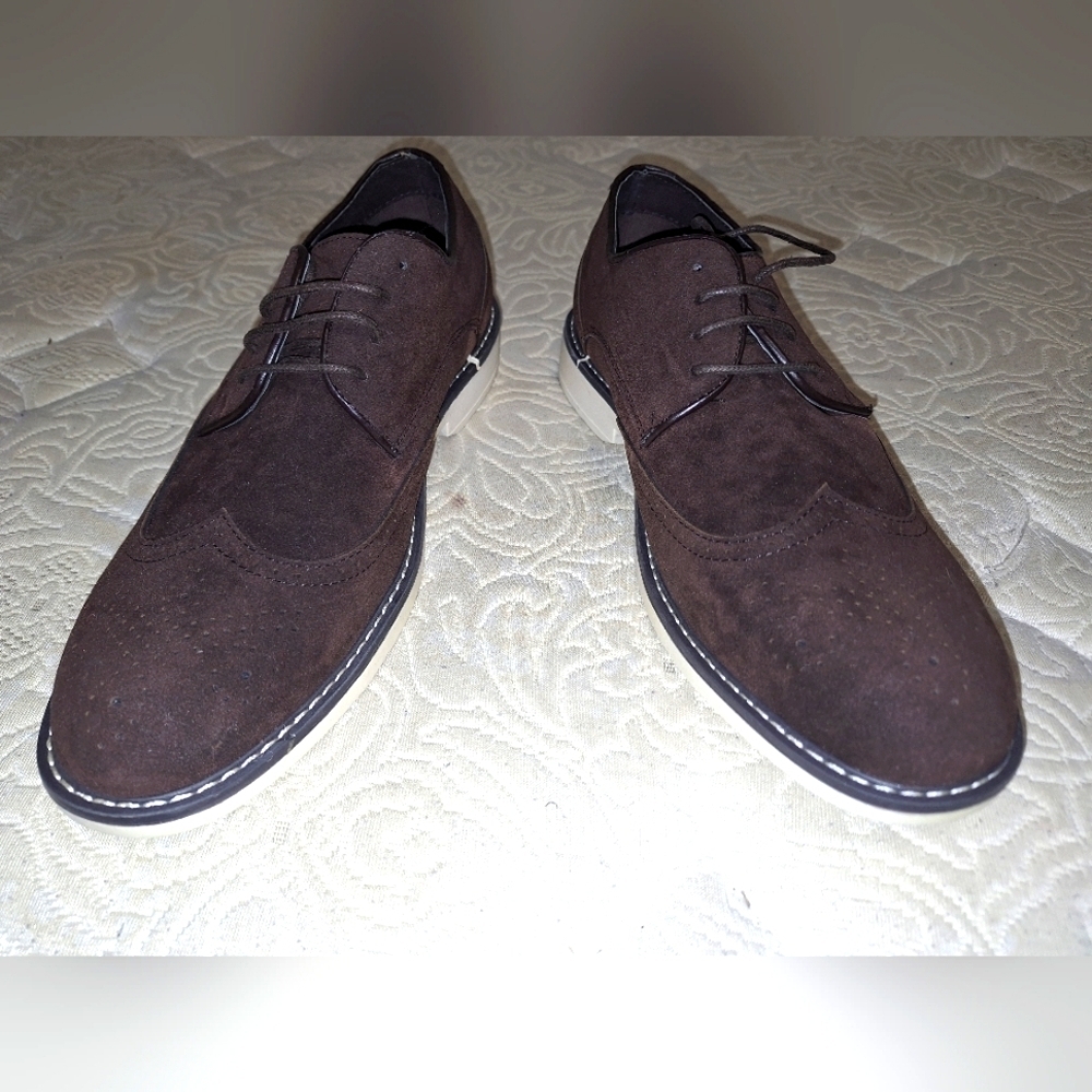 A pair of Franco Vanucci brown suede men's loafers in a size 10.5. EUC.